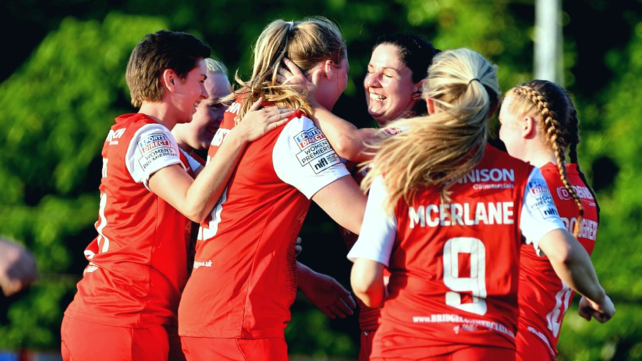 Larne Women players celebrating their second straight win.