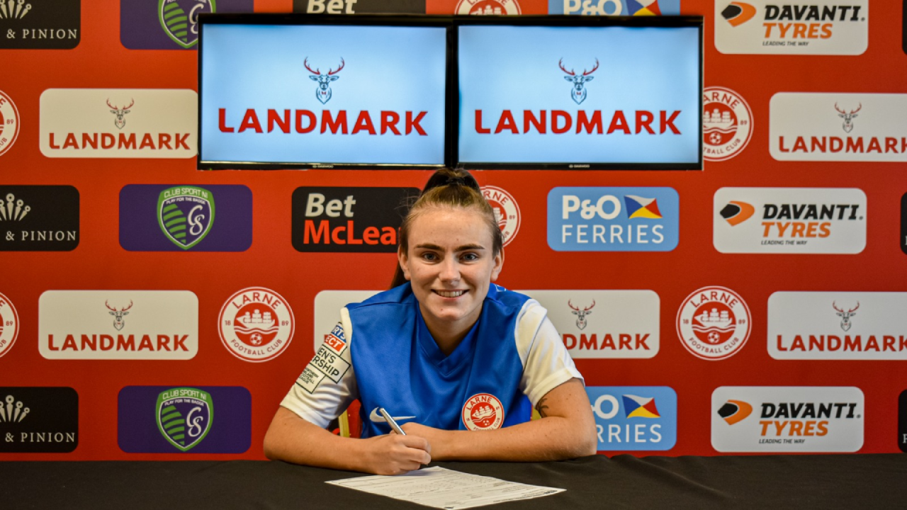 Erin Montgomery signs for the Larne Women.