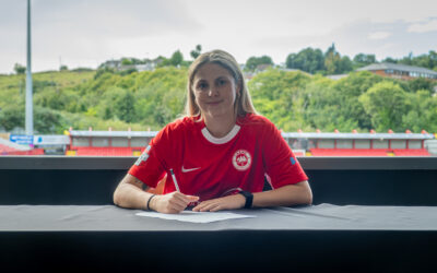 Sasha Clare signs her first professional contract