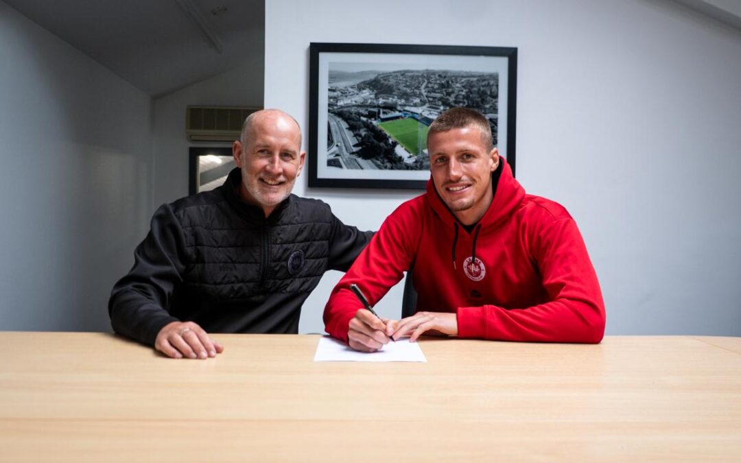 Sam McClelland signs for the Champions